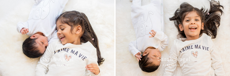 Viyaan makes little sister giggle. photograped by Sarah Angel Photographer Farnham Newborn Photographer