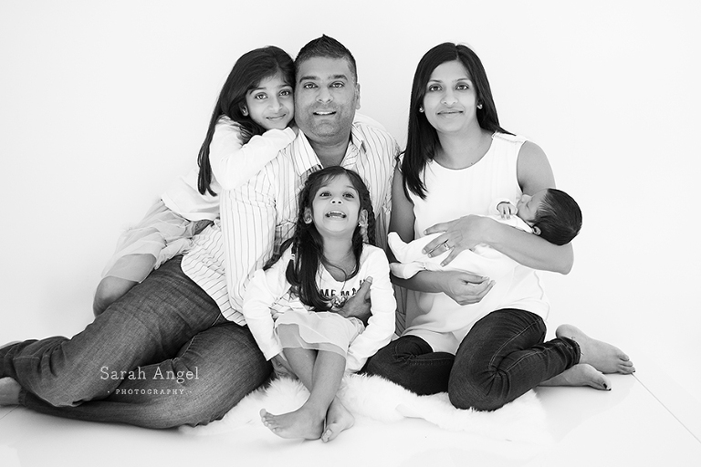 The whole family photographes in Black and White by Sarah Angel Photographer Farnham Newborn Photographer