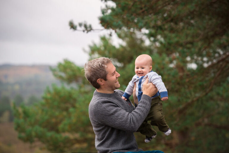 At two months old outdoors showing clients the best age for newborn photography and older baby photoshoots.